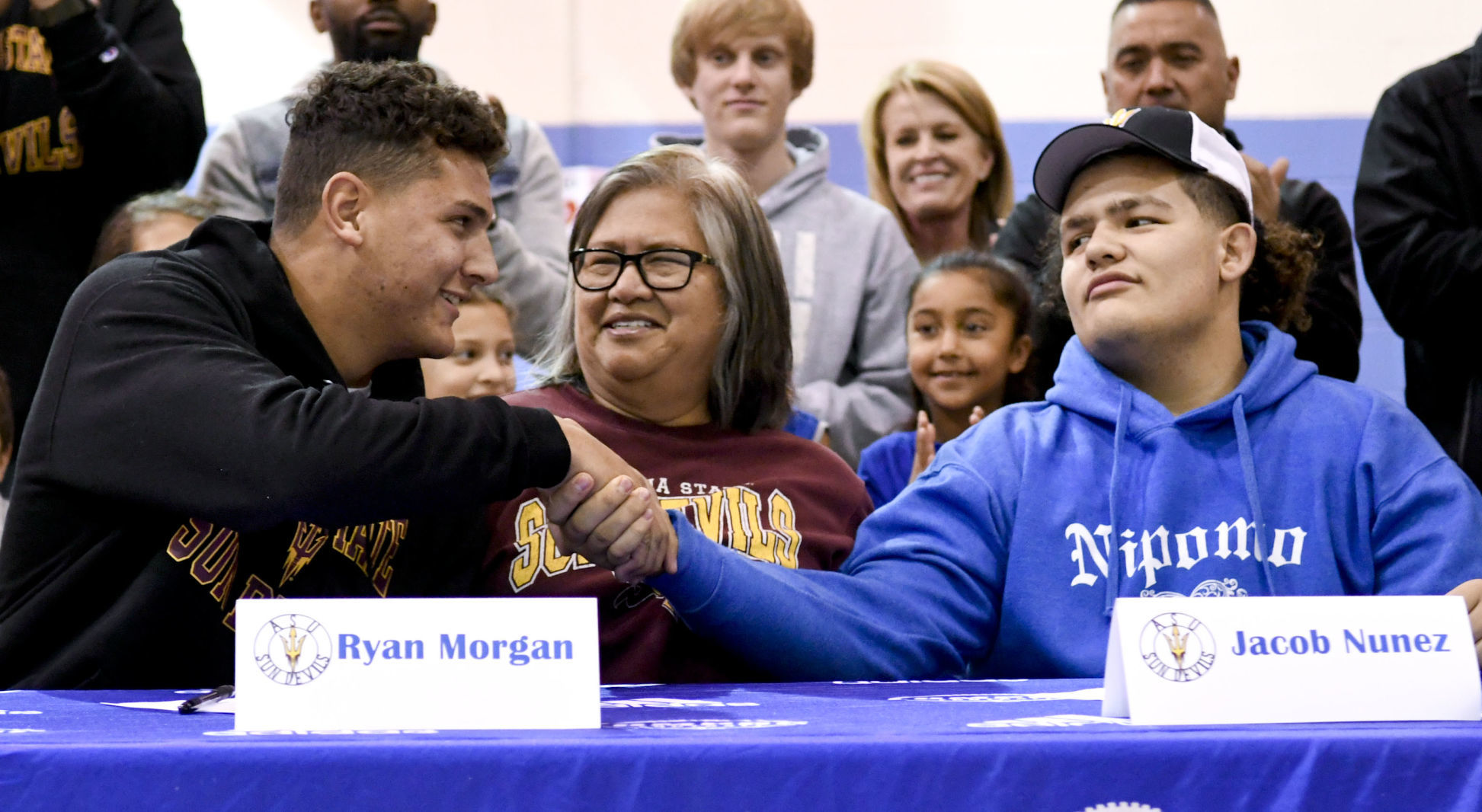 121819 Morgan and Nunez sign 01.jpg